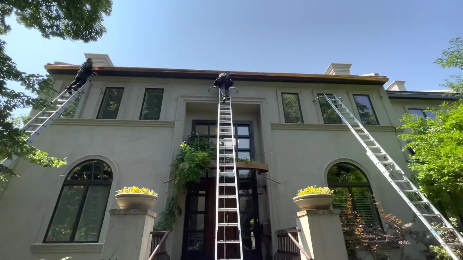 Seamless aluminum gutters on a Front Range home — spring cleaning keeps troughs clear before cottonwood season